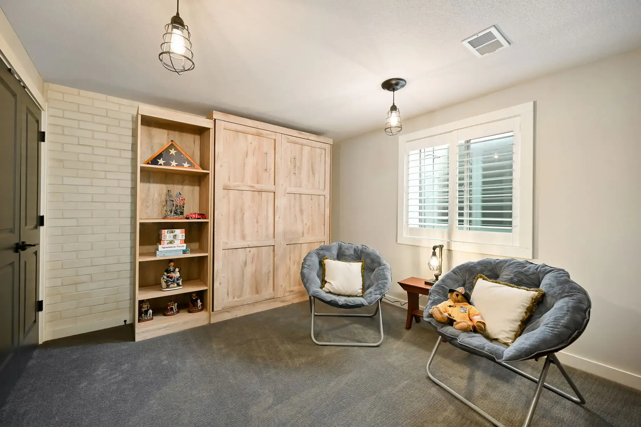 Murphy bed in lower level of this reverse 1.5 story home
